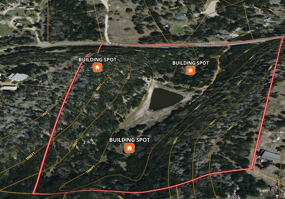 Oblique aerial of the tract at 230 Marshall Dr with a red boundary drawn around it, elevation contour labels across the frame, the pond near the middle, three marked building spots, and Marshall Dr running along the top.