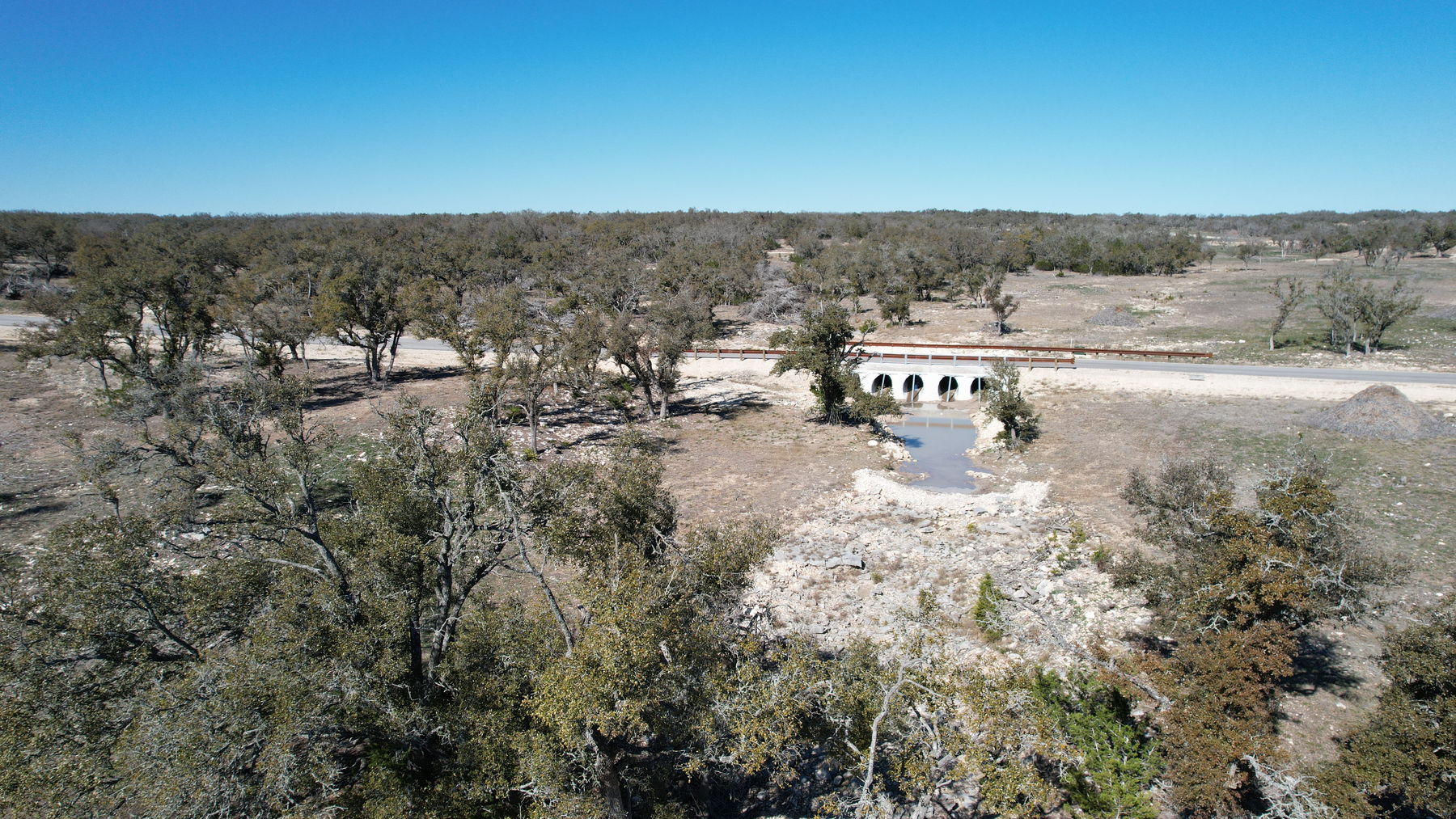 Aerial of the subdivision road crossing the drainage on a four-barrel concrete culvert